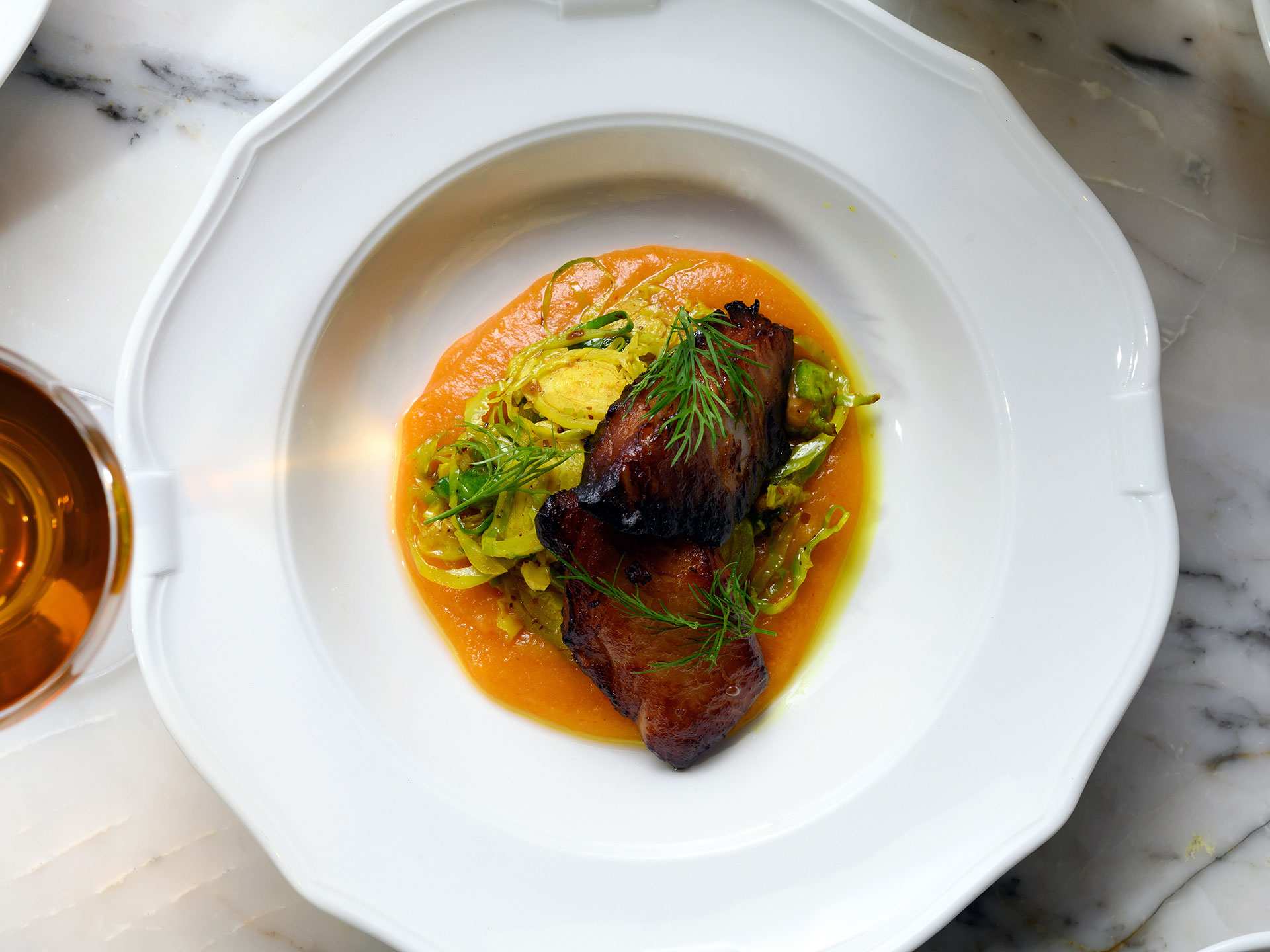 Best patios in Toronto | Sablefish with curried Brussels sprouts and apricot purée at Parquet