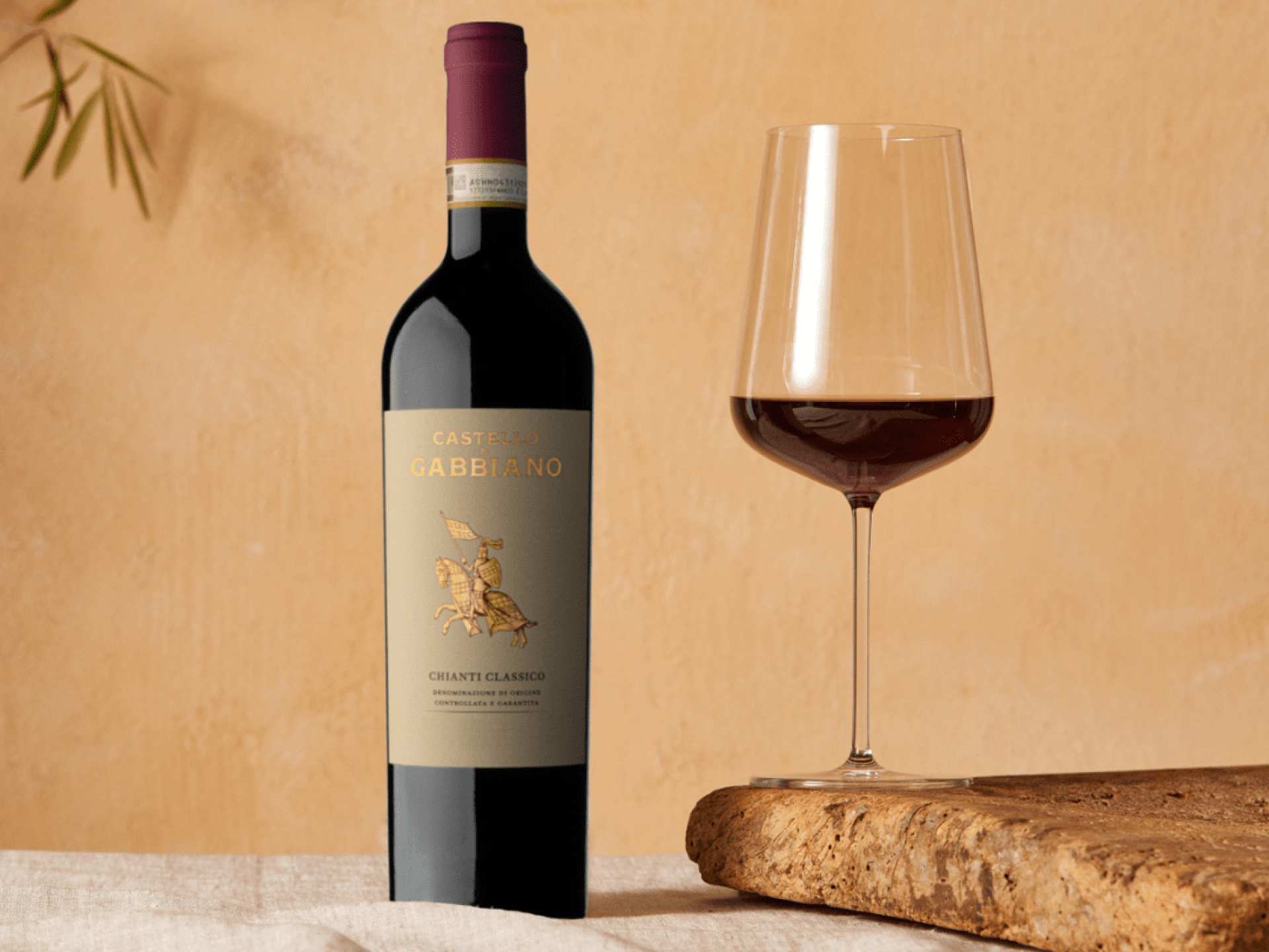 A bottle of Castello di Gabbiano Chianti Classico with a glass of wine