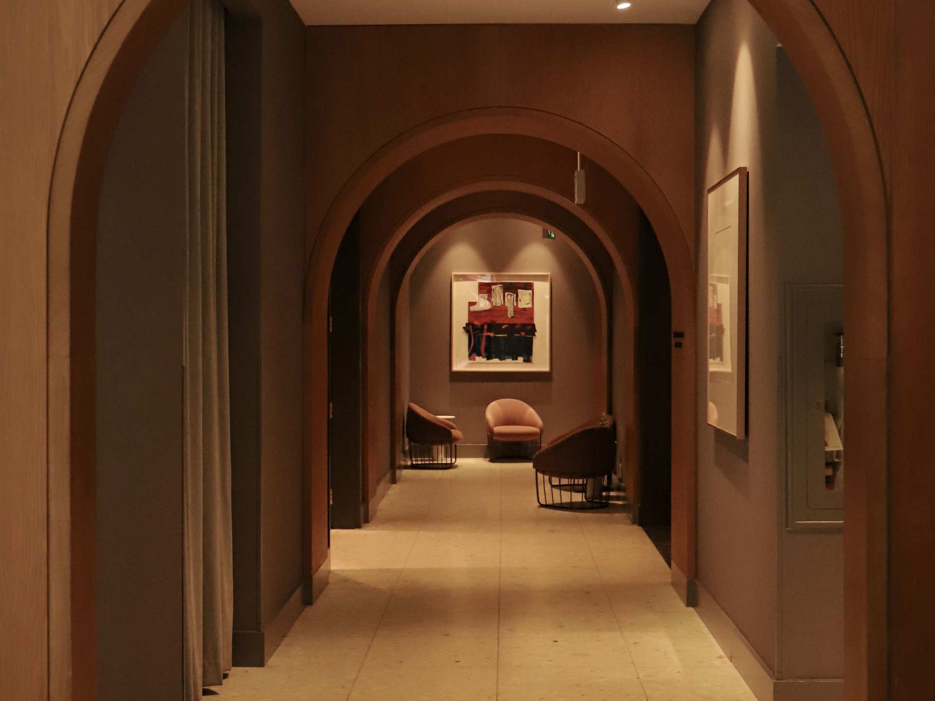 Kimpton Saint George | An arched hallway at the Kimpton Saint George hotel
