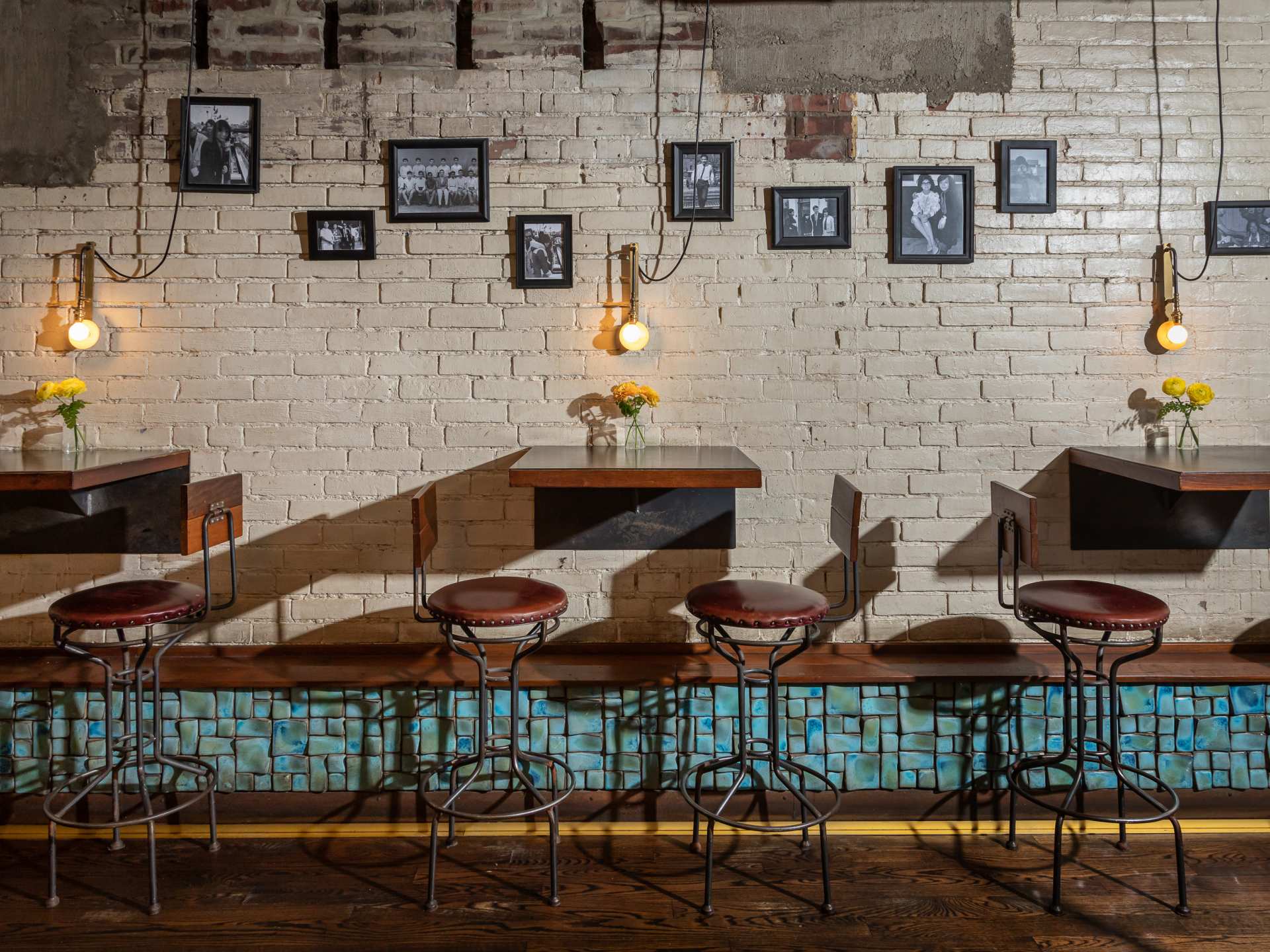 Best restaurants Toronto | Seating under framed photographs at DaiLo