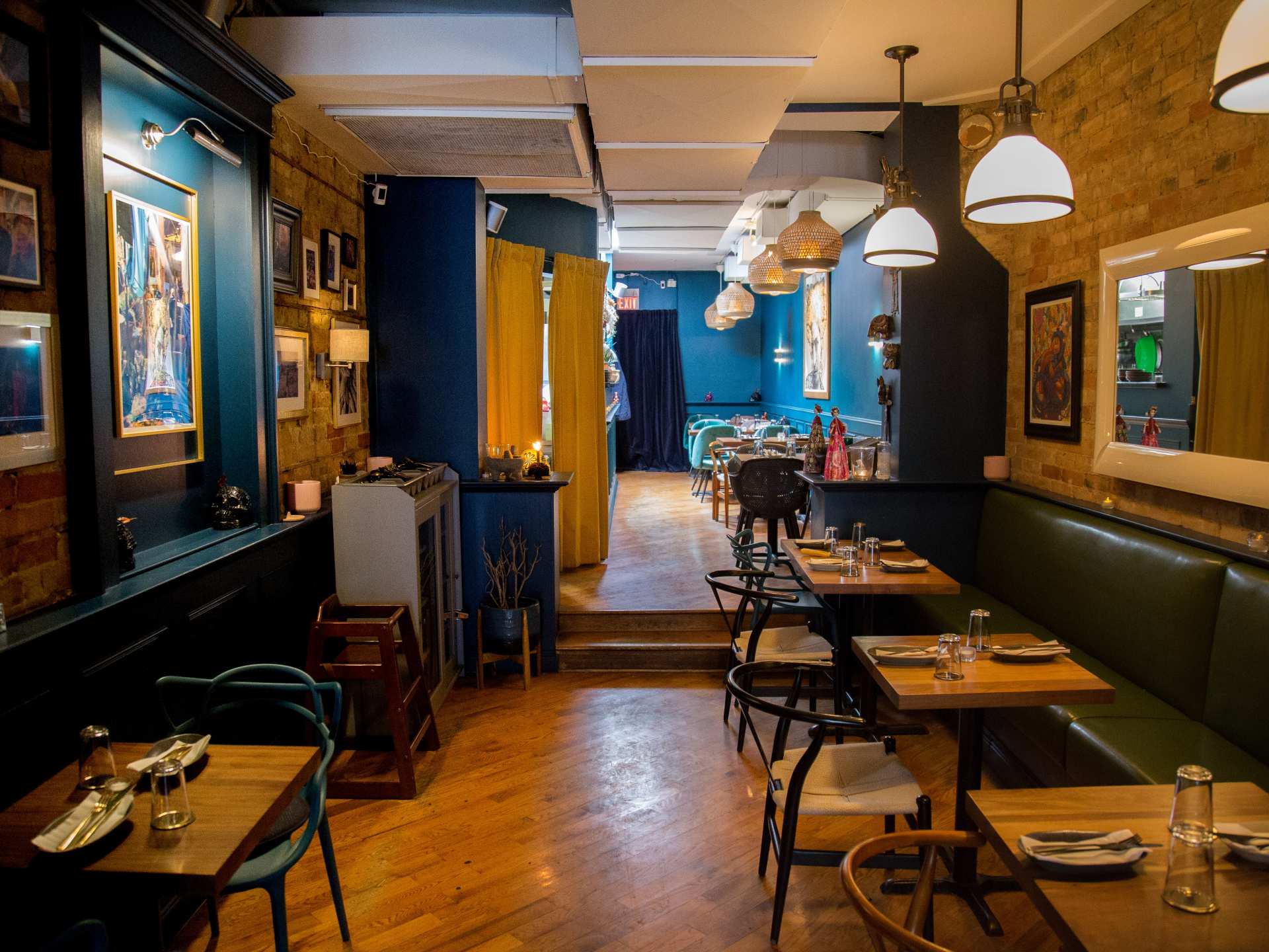Blue cactus leather booths at La Bartola restaurant in Toronto