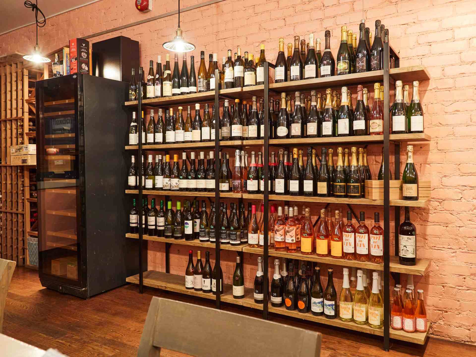 Best wine bars in Toronto | A shelf containing a number of unique international and local wines