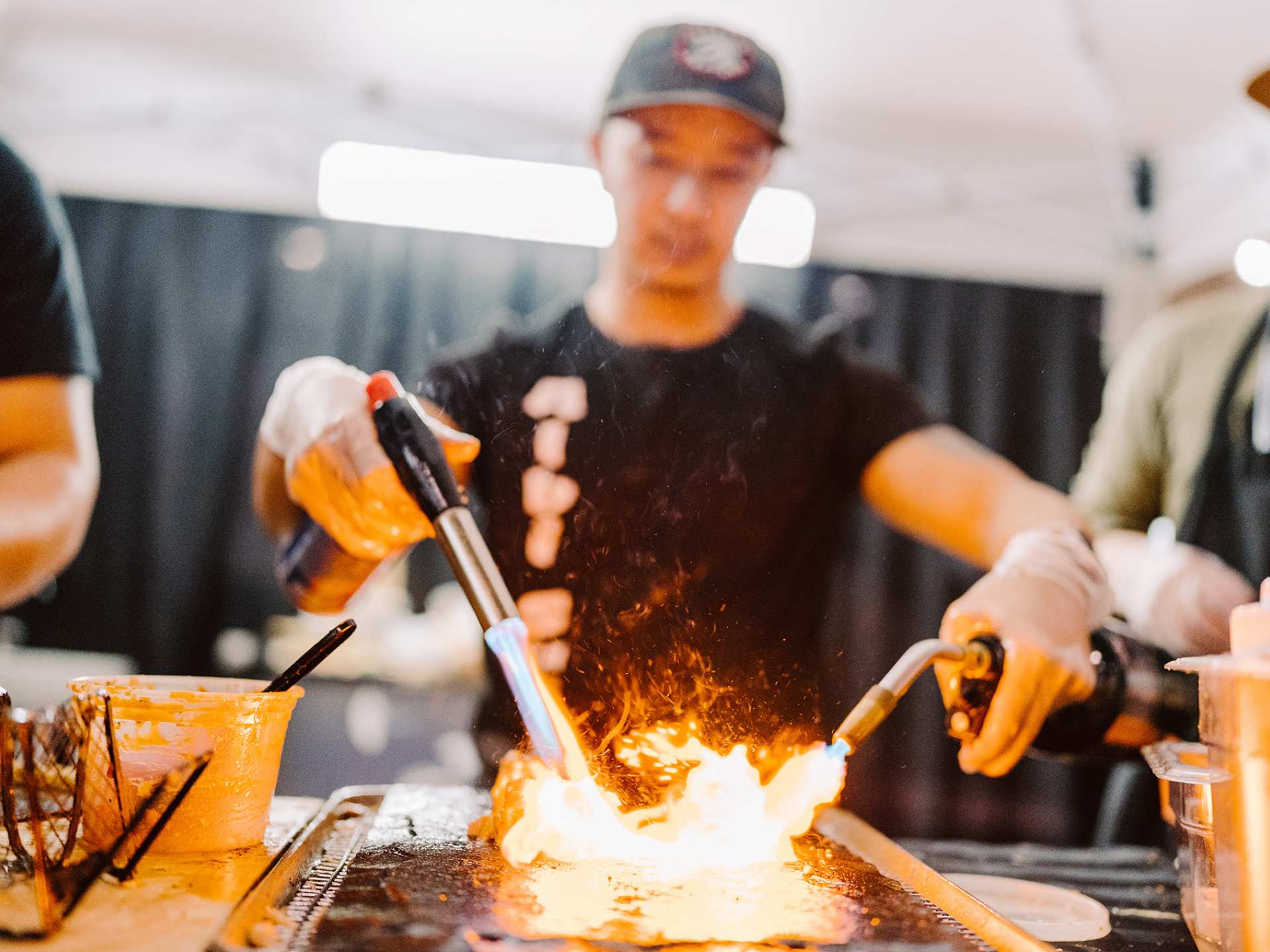 A chef with a blowtorch at T.O. Food and Drink Fest