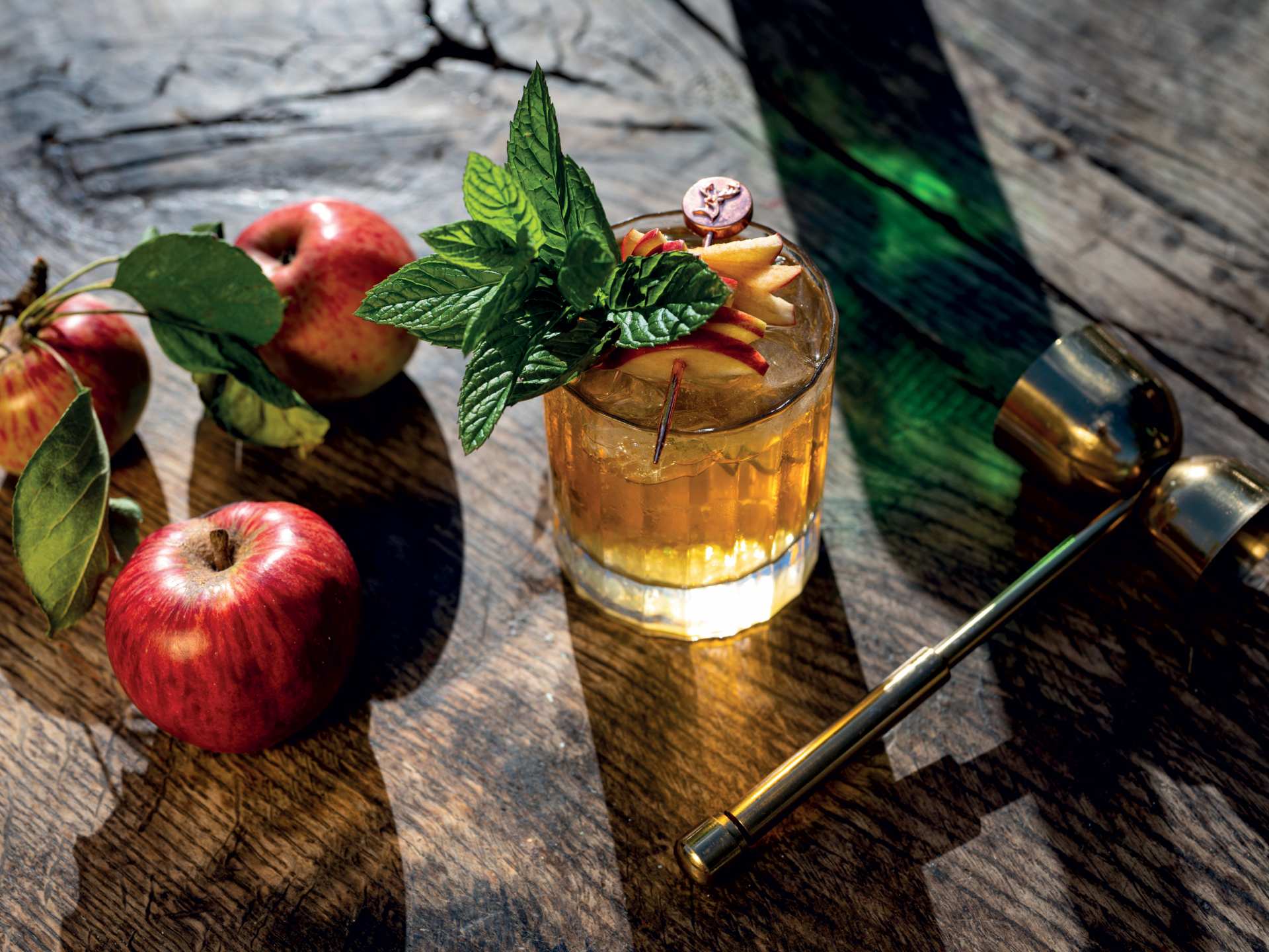 Glenfiddich The Orchard Experiment | The Apple Orchard, a Glenfiddich cocktail, sits next to apples and a jigger