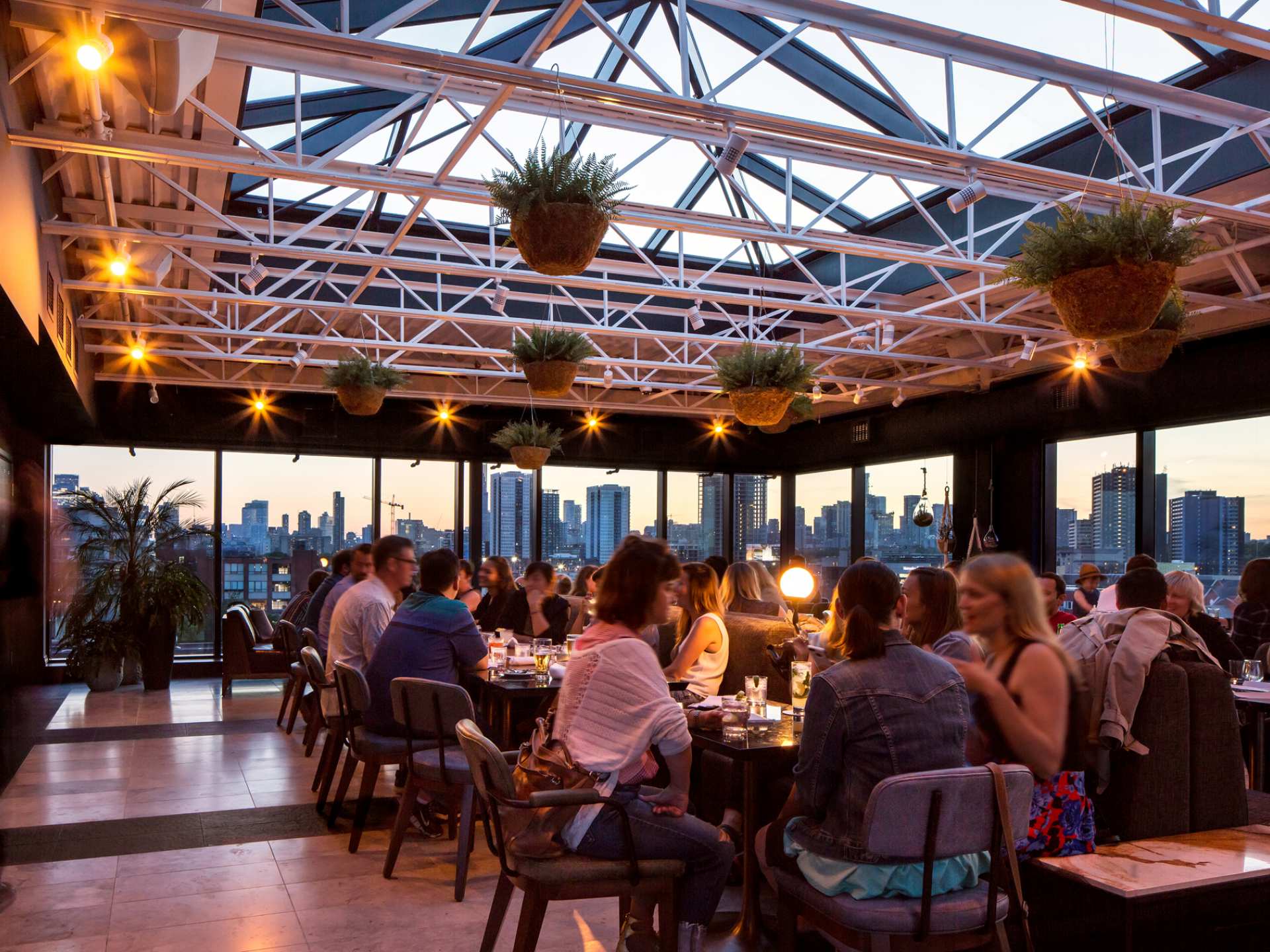 Best patios in Toronto | The crowded indoor space at The Rooftop at The Broadview Hotel