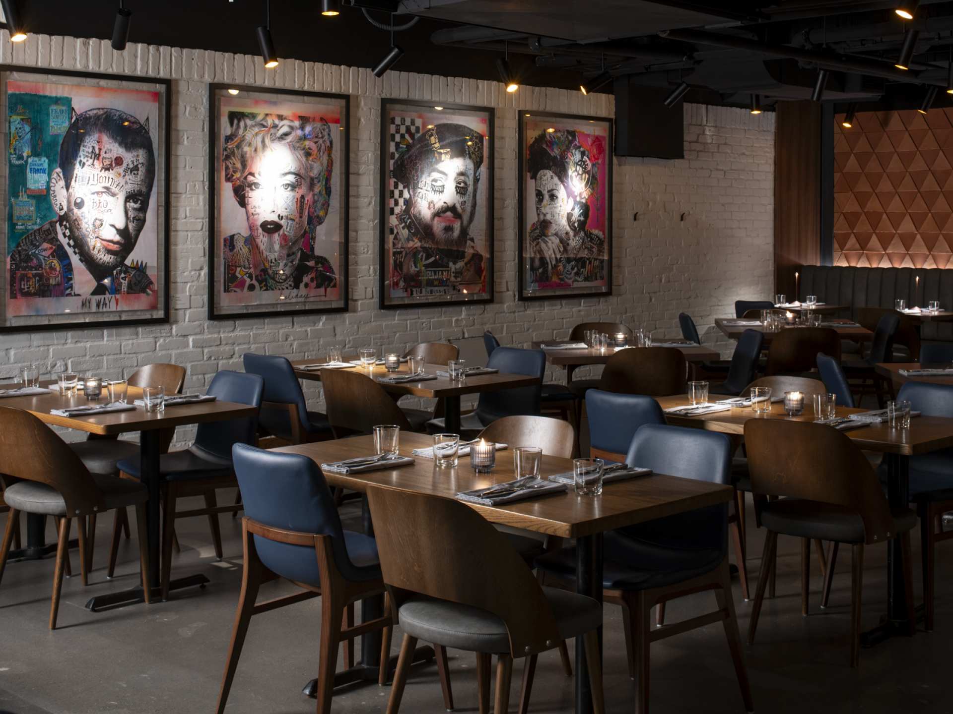 Best new restaurants Toronto | Portraits on the walls in the dining room at Edna + Vita