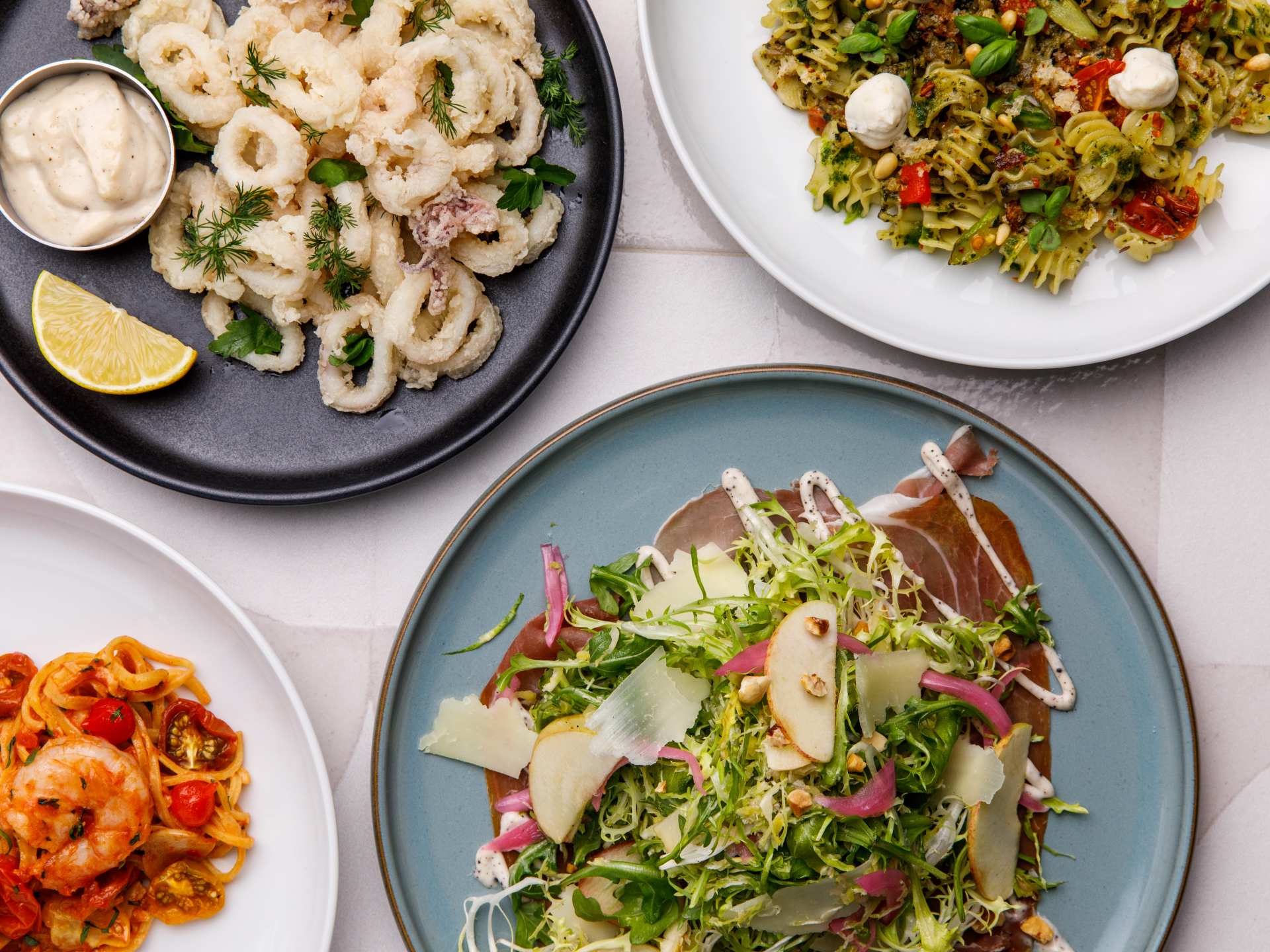 Best new restaurants Toronto | Salad, calamari and pasta at Edna + Vita