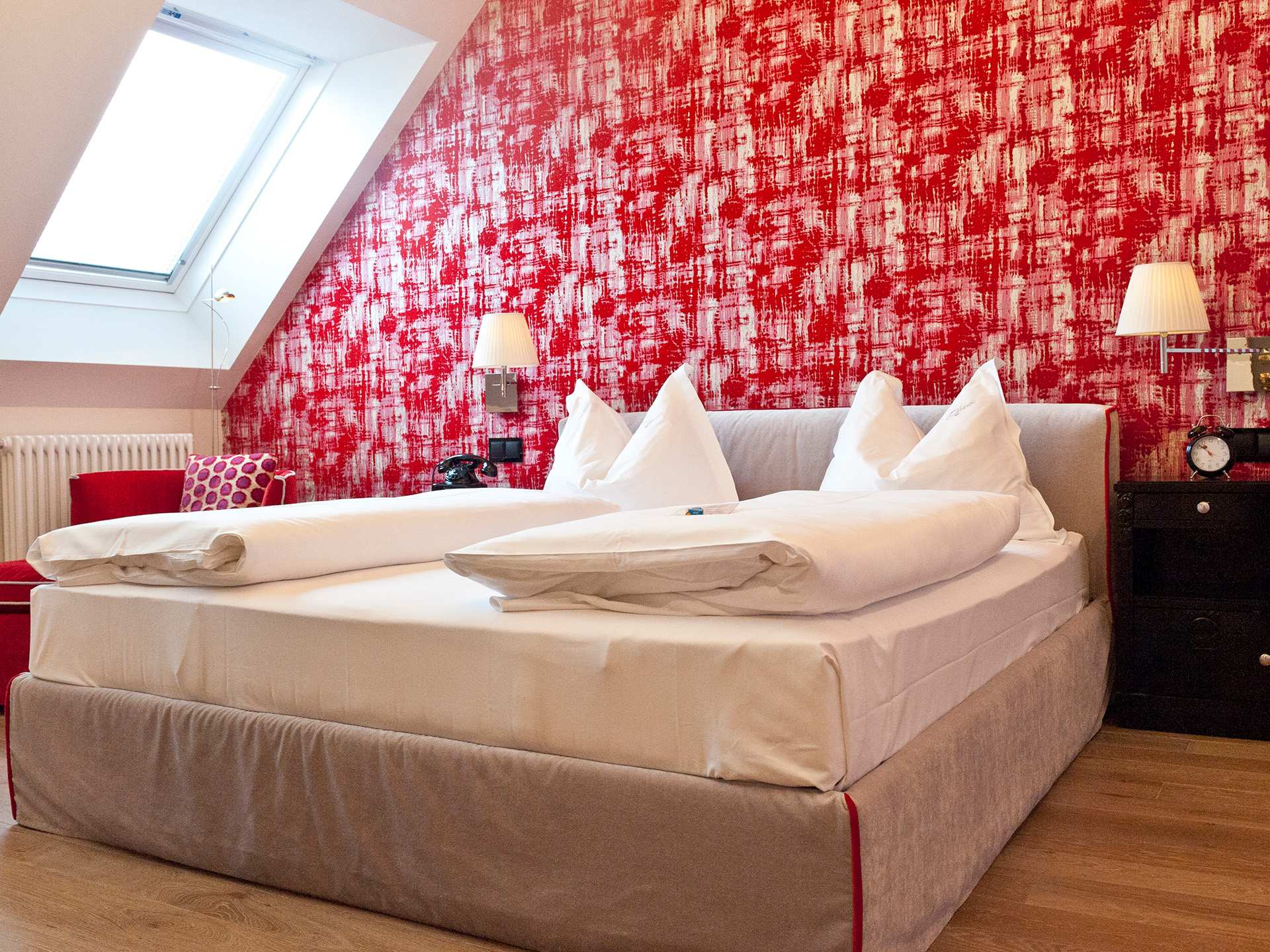 One of the red hotel rooms at Hotel Beethoven
