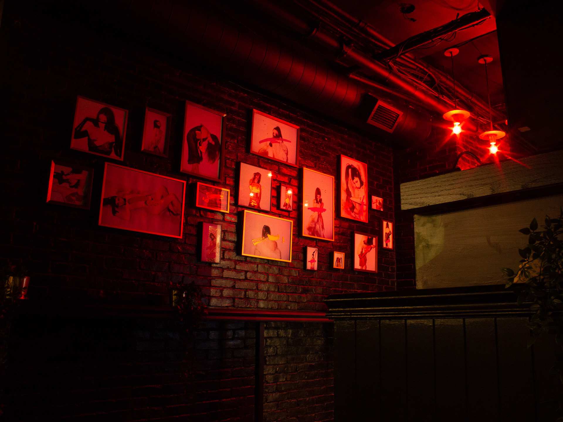 Best new Toronto restaurants | A photo wall at Baby's Cabaret