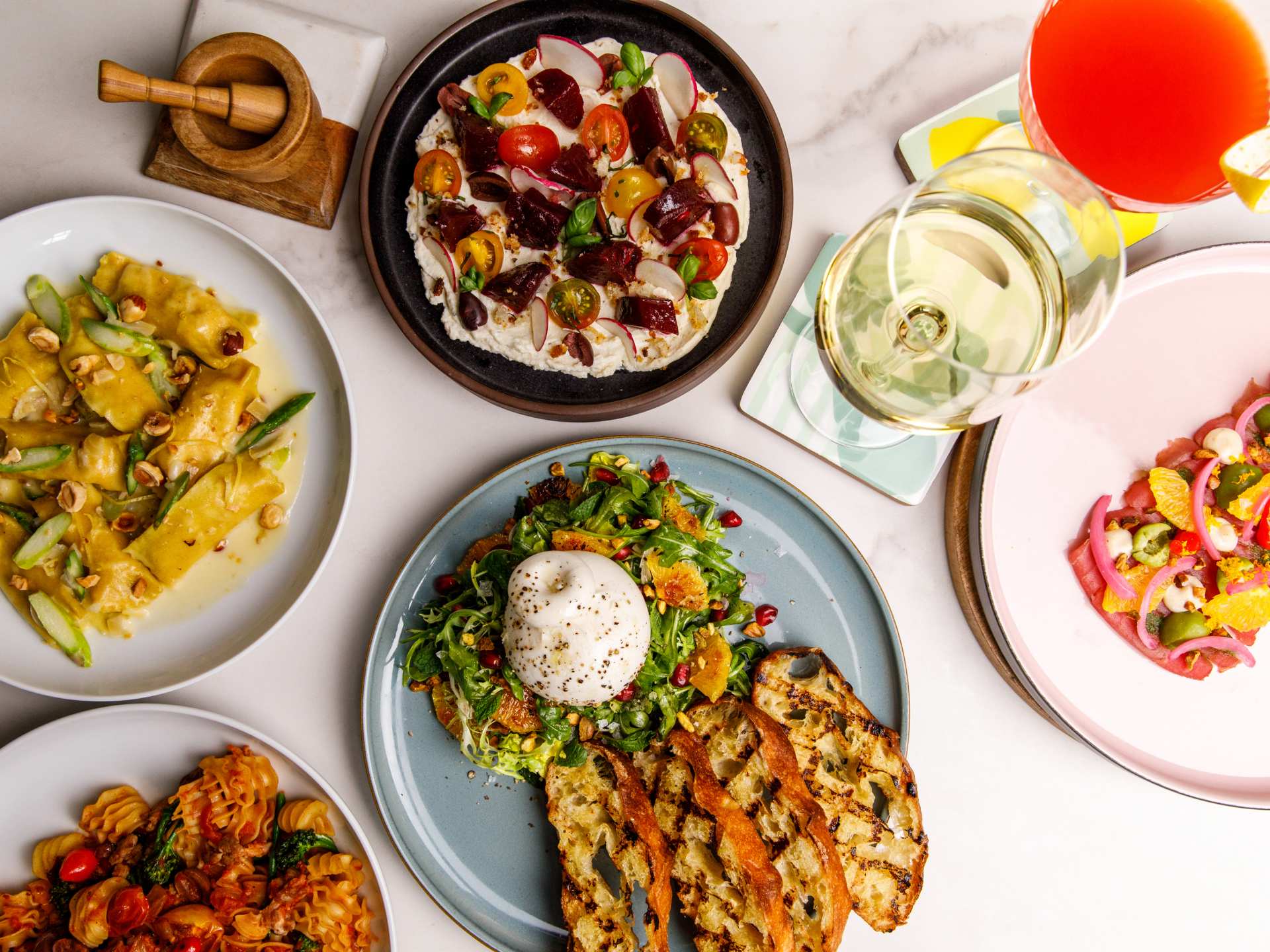 Best new restaurants Toronto | A spread of dishes and drinks at Edna + Vita