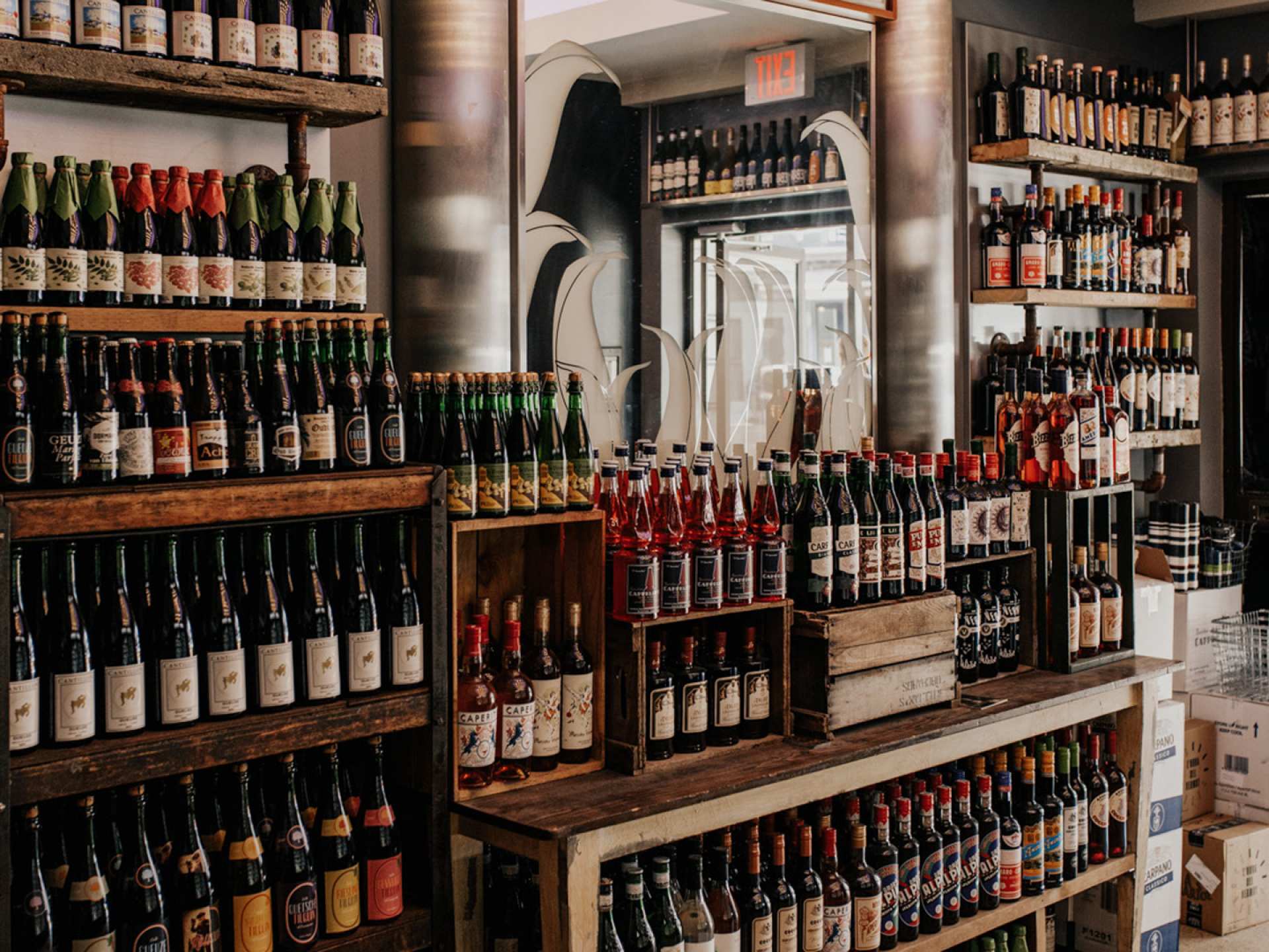 Toronto bottle shops and alcohol stores | Neatly stacked wine shelves at Bottega Volo