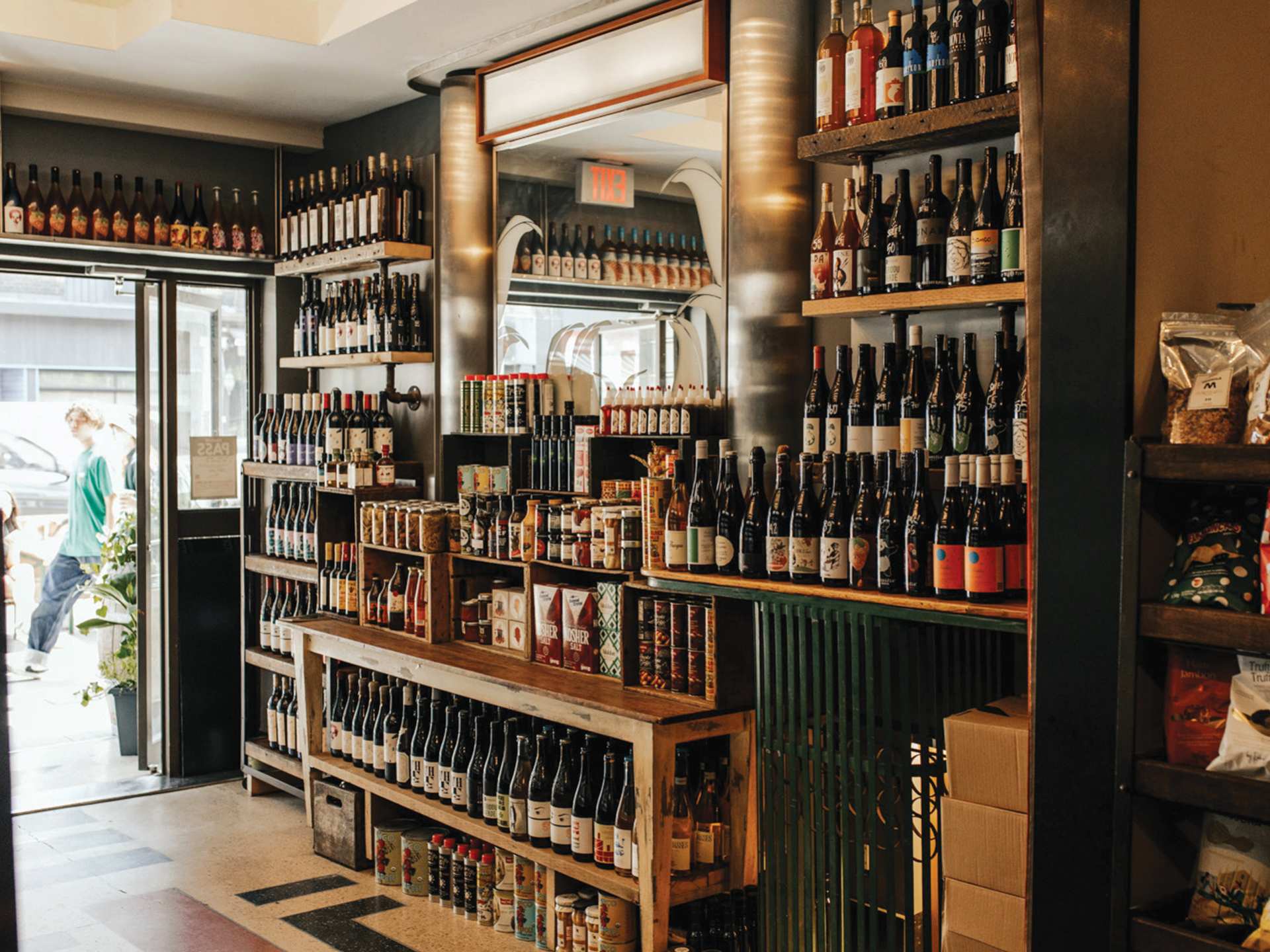 Toronto bottle shops and alcohol stores | Shelves of drinks at Bottega Volo in Littly Italy, Toronto