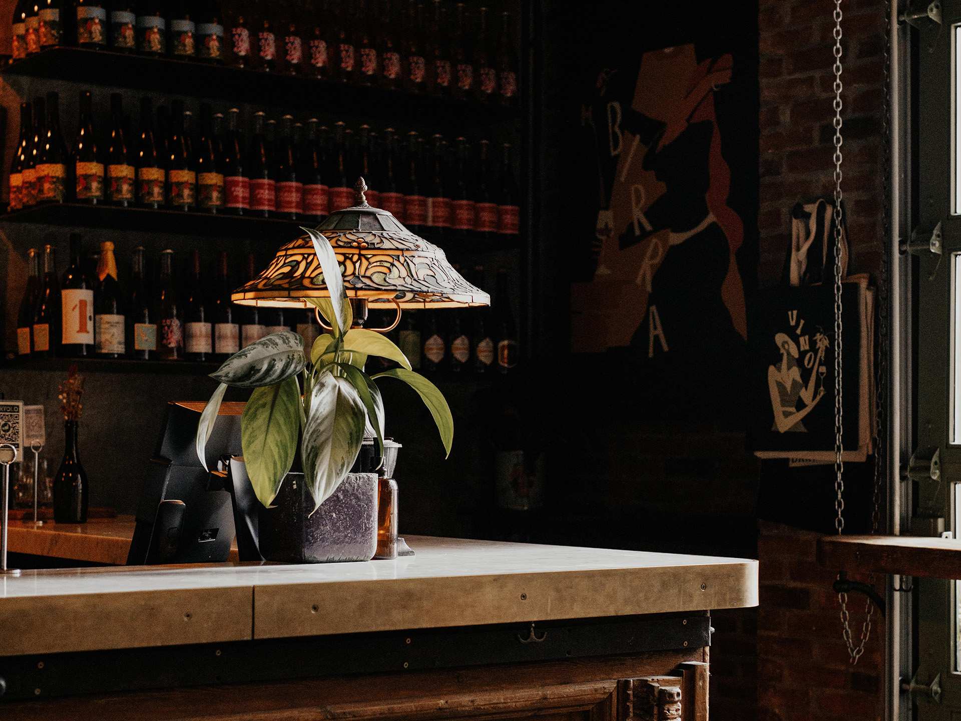 Best Italian restaurants in Toronto | A corner of the bar with a lamp at Bar Volo