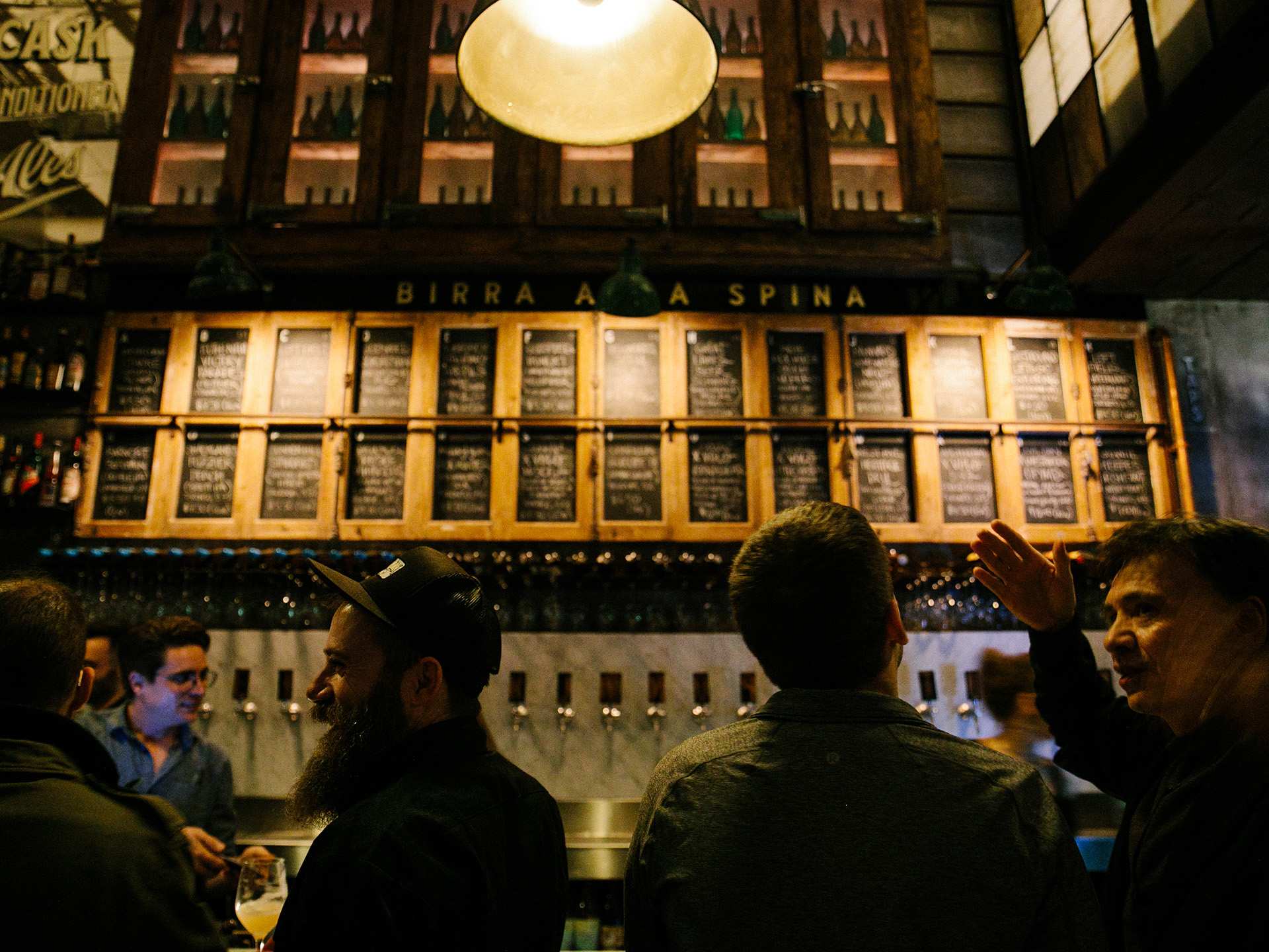 The best Italian restaurants in Toronto | The beers on tap at Bar Volo, written on a chalkboard