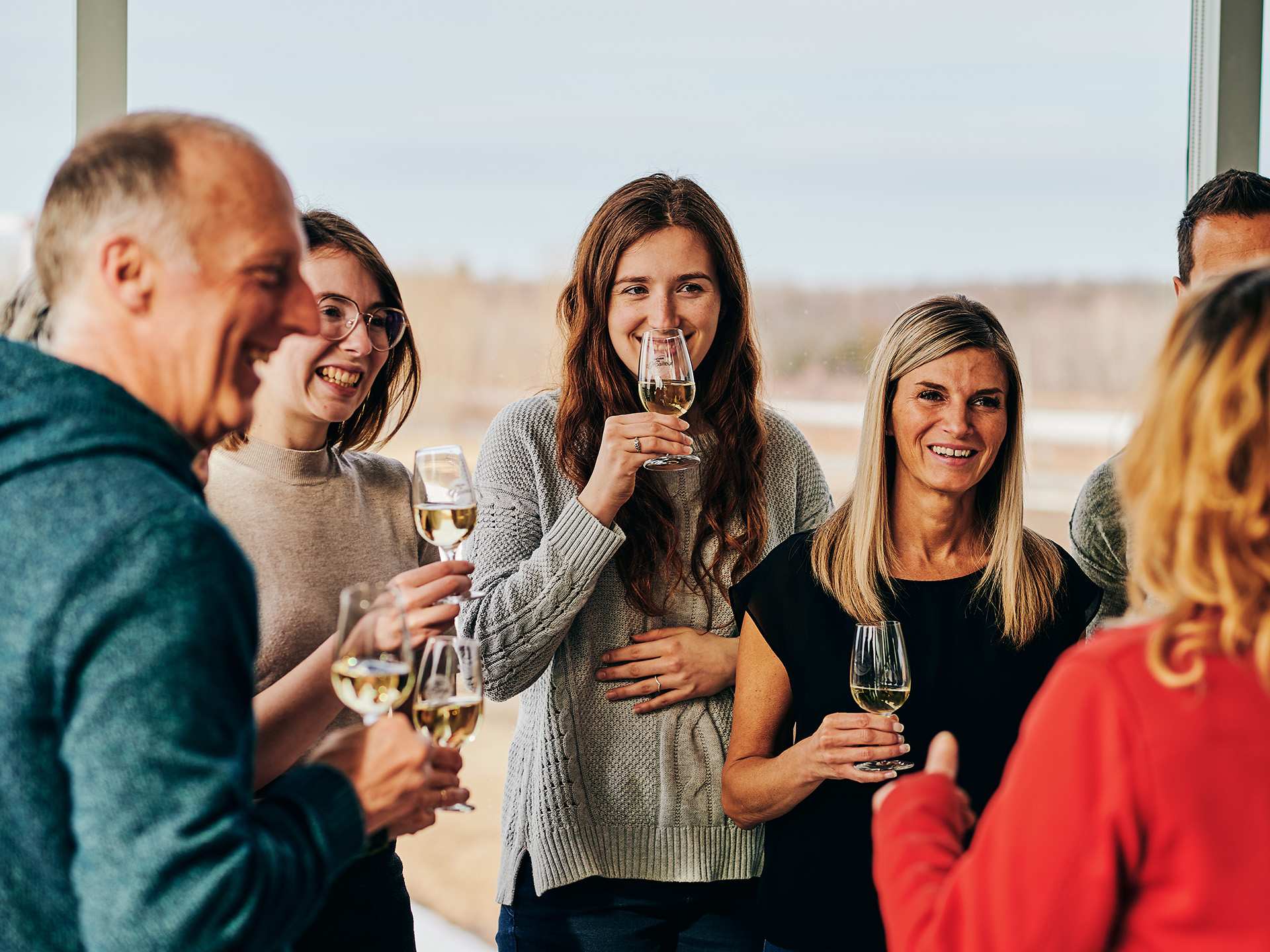 A group of people enjoying wine