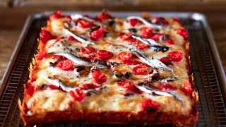 The best new restaurants in Toronto | Mediterranean Detroit-style pan pizza with boquerones, olives, tomatoes, cheese & tomato sauce at Gianna’s Patties and Pies