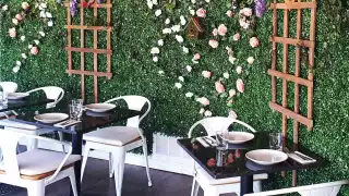 The flower wall inside La Fontana, one of the best Elora restaurants