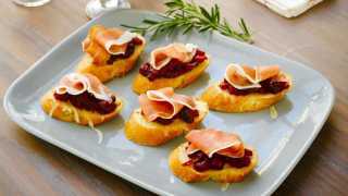Italian appetizers: Prosciutto di Parma Cranberry Crostini