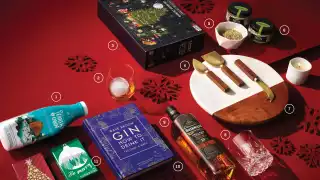 Food and drink holiday Christmas gifts | A flat lay of holiday-themed gifts Food and drink holiday Christmas gifts | A flat lay of holiday-themed gifts