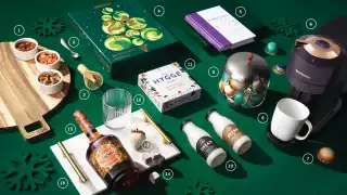 Food and drink holiday Christmas gifts | A flat lay of holiday-themed gifts Food and drink holiday Christmas gifts | A flat lay of holiday-themed gifts
