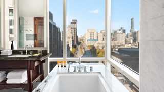 The best Toronto hotels for a staycation | The Shangri-La hotel bathtub overlooking University Ave.