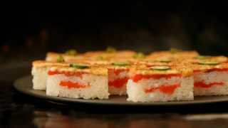 Sushi types and how to eat sushi | A platter of salmon oshi at Minami Toronto