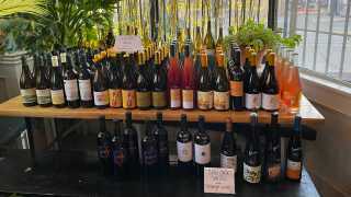 The best bottle shops in Toronto | A shelf of wine bottles at Midfield wine bar