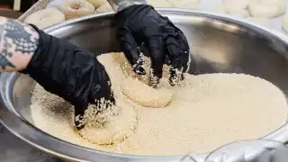 Toronto home cooks and their online food businesses | Rolling bagels in sesame seeds