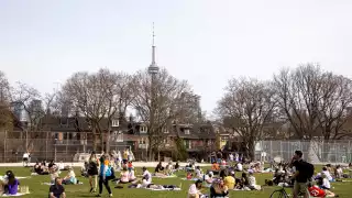 Trinity Bellwoods neighbourhood guide | People sitting in Trinity Bellwoods Park