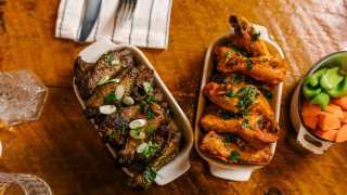The best new restaurants in Toronto | Two different kinds of Betty's chicken wings at CoMMO Kitchen