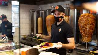 The best new restaurants in Toronto | Staff serve German Doner Kebabs