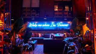 The best patios in Toronto | A neon sign lights up the patio at Xango