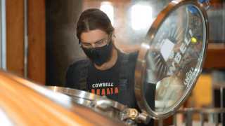 What is craft beer? An essential guide to Ontario craft beer | A brewer making craft beer at Cowbell Brewing Co.