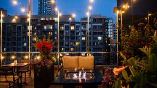 The best rooftop patios in Toronto | A warm fire pit on a cool night at Victor Rooftop Terrace