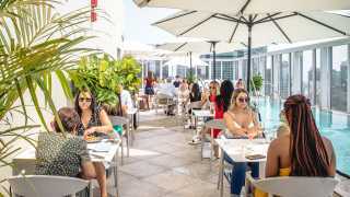 The best rooftop patios in Toronto | People dine on the rooftop patio at KOST