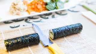 Places offering cool cooking classes in Toronto | A sushi roll being made in a class