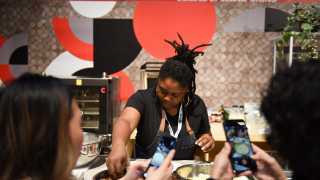 The RC Show | Attendees snap pictures of a live cooking demo at the RC Show