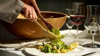 Accessible restaurants in Toronto | A caesar salad tossed table-side at Hy's steakhouse