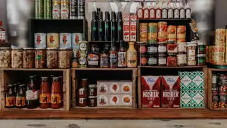 Bottega Volo | Cans, jars and other pantry items on shelves at Bottega Volo