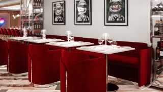 Best restaurants in Yorkville | White tables and red chairs at Sofia