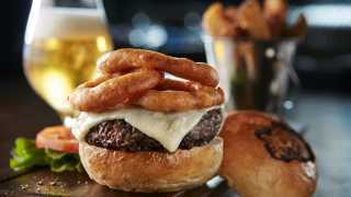 Toronto's best steakhouses | A burger and onion rings at Blue Blood