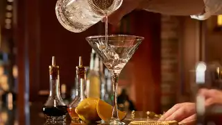 Toronto's best steakhouses | A bartender pours a martini at Hy's Steakhouse & Cocktail Bar