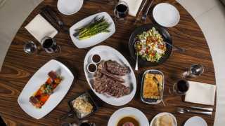 Toronto's best steakhouses | An overhead shot of steak and sides at STK Toronto
