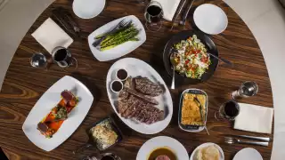Toronto's best steakhouses | An overhead shot of steak and sides at STK Toronto