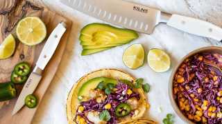 Kilne Ultimate Knife Set review | Santoku knife and paring knife on counter with bright tacos