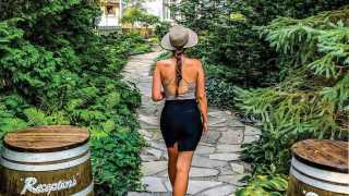 A girl walks through Reif Estate Winery in Niagara