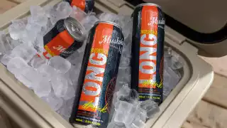 Several cans of the Muskoka Long Drink in a cooler full of ice