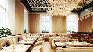A floral chandelier hangs over the dining room at Laylak