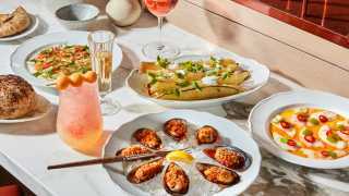 New culinary experiences in Toronto | A spread of dishes at Toronto Beach Club