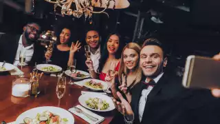 Fine Dining Lovers The Dining Out Survey | A group of friends around a table at a fine dining restaurant